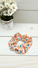 Load image into Gallery viewer, Ribbed Retro Flowers Blue and Orange on Ivory  Scrunchie
